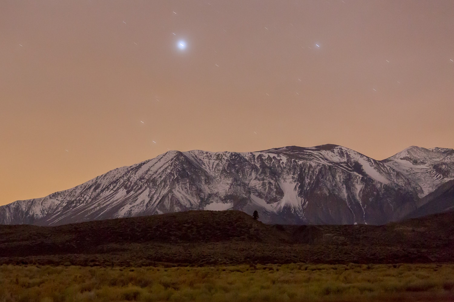 Snowy mountains at night, seen from Mono Lake